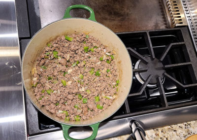Cooking hamburger, onion, and green pepper